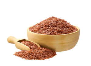 A bowl of red rice, known for its rich fiber and nutrient content.